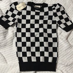 Womans black and white checkered sweater top